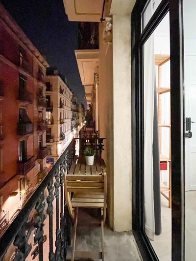 Nighttime city views from cozy balcony